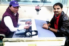 "Shashi Sharma Majgainya, as a lyricist, is giving an interview at Radio Nepal with Ram Aviral."